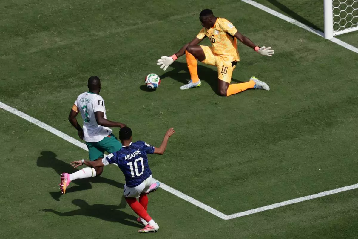 France's Kylian Mbappe scores during the World Cup Group I soccer match between France and Senegal in East Rutherford, N.J., near New York, Tuesday, June 16, 2026. (AP Photo/Adam Hunger)