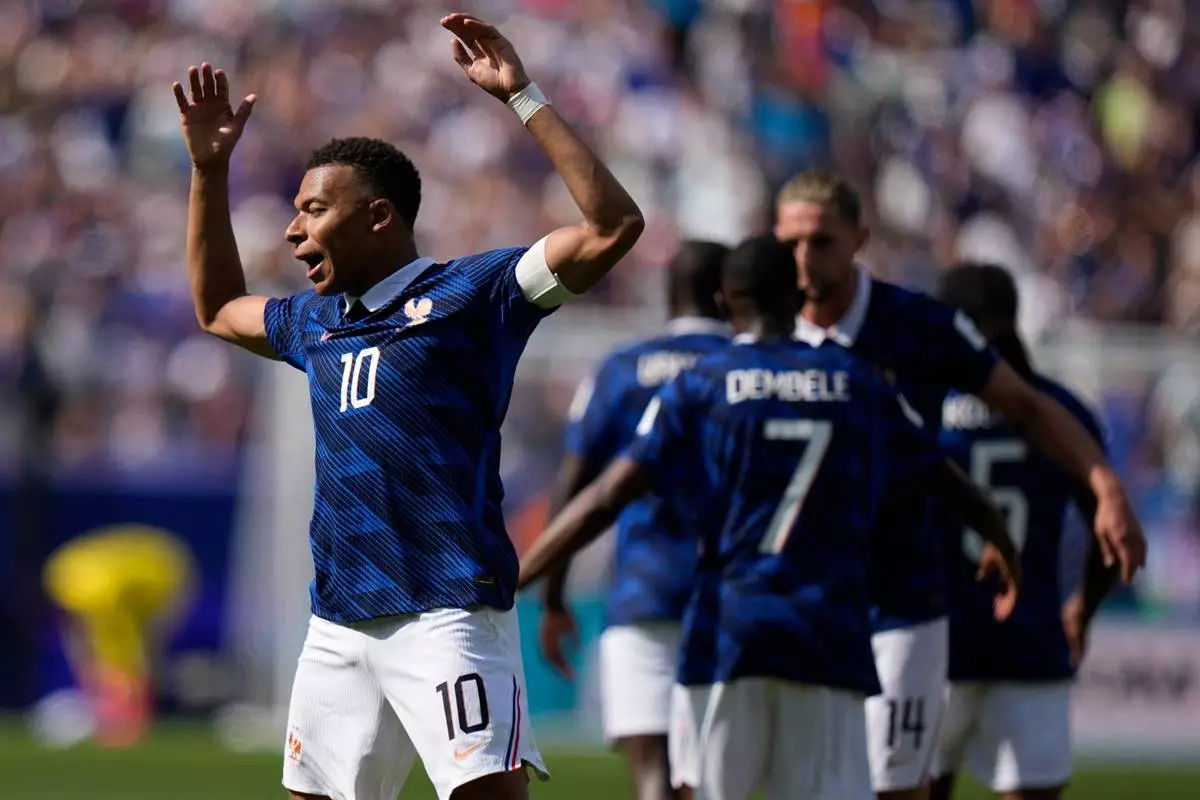 France's Kylian Mbappe celebrates after scoring the opening goal of his team during the World Cup Group I soccer match between France and Senegal in East Rutherford, N.J., near New York, Tuesday, June 16, 2026. (AP Photo/Frank Franklin II)