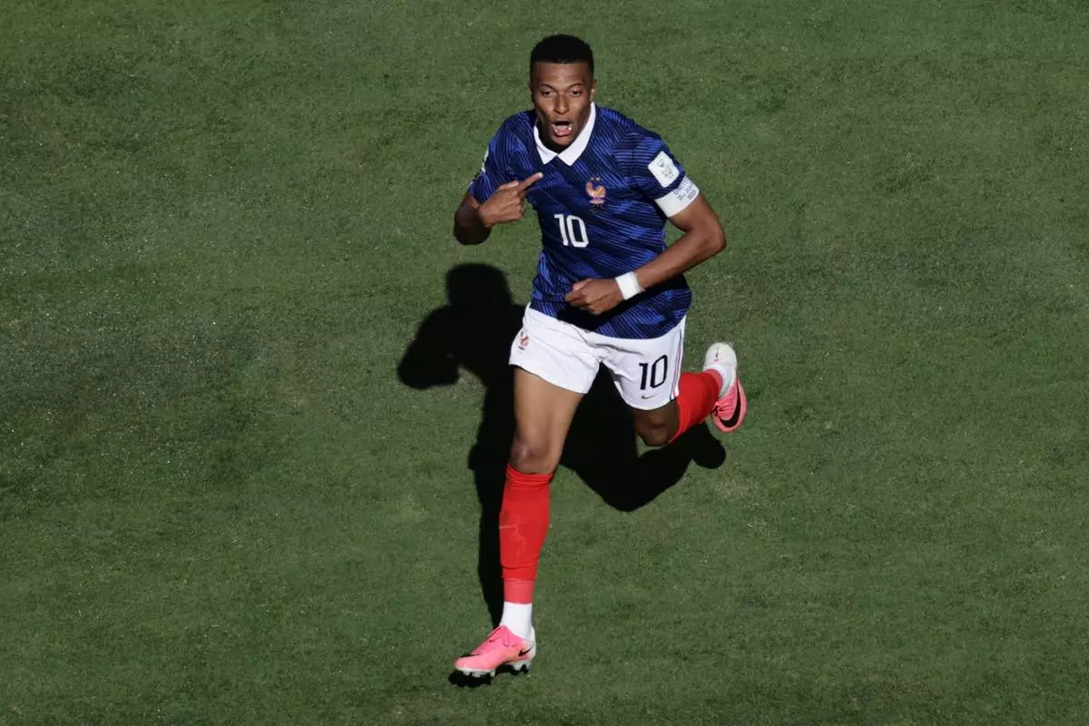 France's Kylian Mbappe celebrates after scoring thrid goal during the World Cup Group I soccer match between France and Senegal in East Rutherford, N.J., near New York, Tuesday, June 16, 2026. (AP Photo/Adam Hunger)
