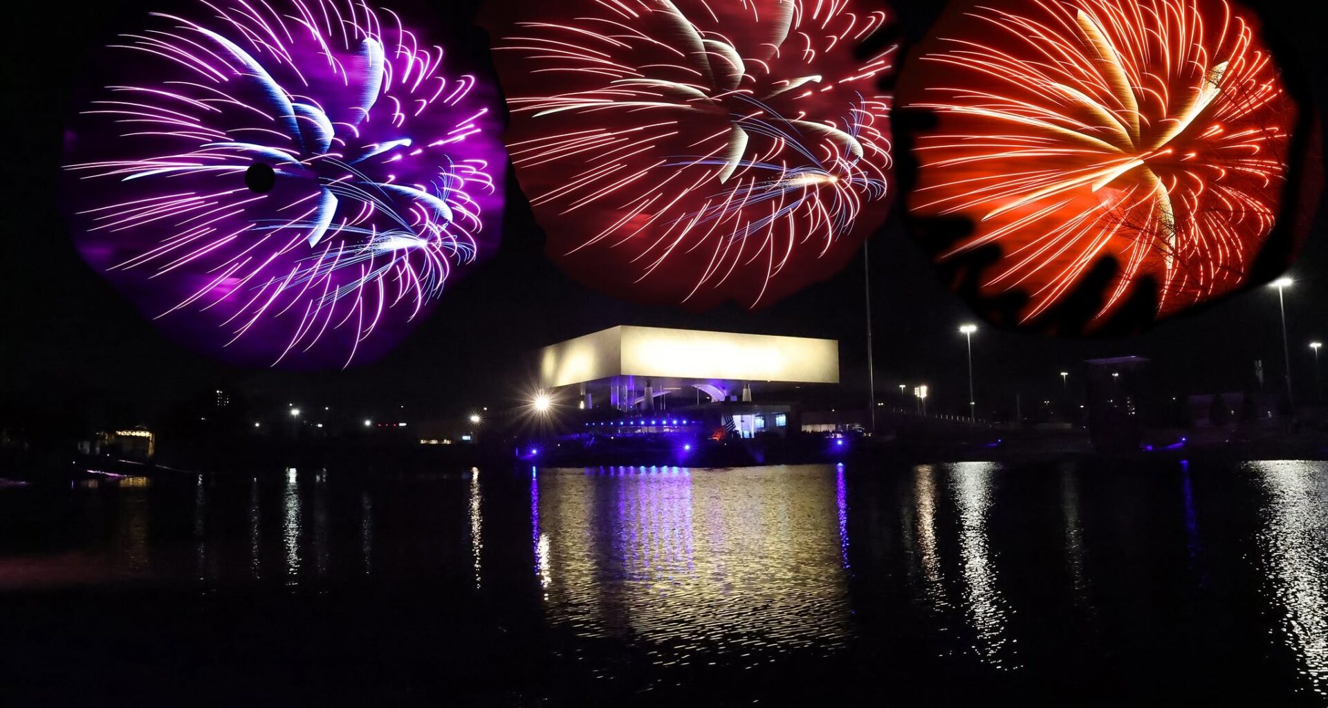 Vibrant fireworks over the water in front of the National Medal of Honor Museum
