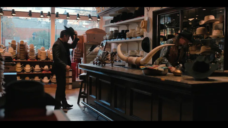 Joaquin (Juan Pablo Raba) shops for a hat in “Dutton Ranch” season 1, episode 6.