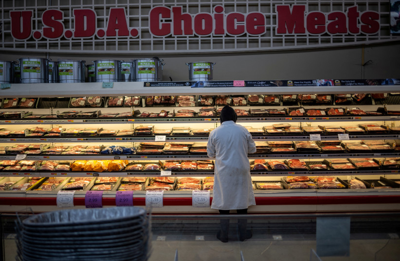 An employee stands at the meat section of a local supermarket located near a Tyson Foods meatpacking plant (not pictured), which is scheduled to shut down in the coming days, in Lexington, Nebraska, U.S. January 14, 2026.