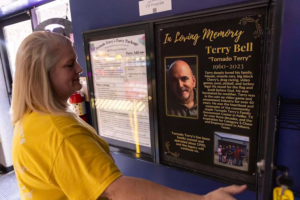 Shannon Bell, the owner of Tornado Terry's, looks at the poster dedicated to her late husband Terry, who ran the business with her and passed away in 2023, in Keller on Friday, Nov. 14, 2025.