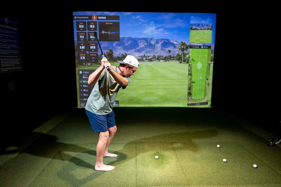 Tony Polio practices his golf swing at Five Iron Golf during its grand opening celebration on Thursday, June 11, 2026 in Fort Worth.