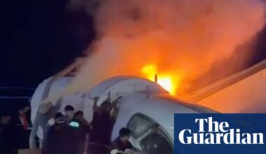 Rescuers rush to save people from crashed jet on Texas highway – video | Texas