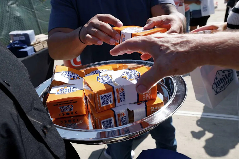 Guests reach for White Castle Sliders after a groundbreaking ceremony for a White Castle in The Colony, Tuesday, June 2, 2026. (Chitose Suzuki/The Dallas Morning News)