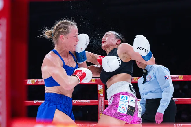 Albuquerque boxer Holly Holm throws a punch at El Paso boxer Stephanie Han during their WBA lightweight world championship bout Saturday, May 30, 2026, at the El Paso County Coliseum in El Paso, Texas.