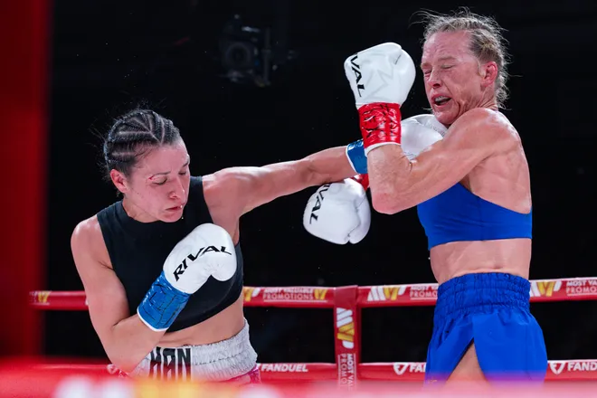 El Paso boxer Stephanie Han throws a punch at Albuquerque boxer Holly Holm during their WBA lightweight world championship bout Saturday, May 30, 2026, at the El Paso County Coliseum in El Paso, Texas.