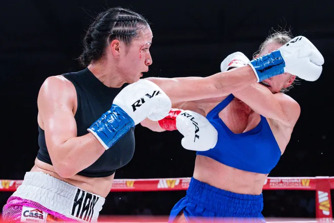 El Paso boxer Stephanie Han throws a punch at Albuquerque boxer Holly Holm during their WBA lightweight world championship bout Saturday, May 30, 2026, at the El Paso County Coliseum in El Paso, Texas.