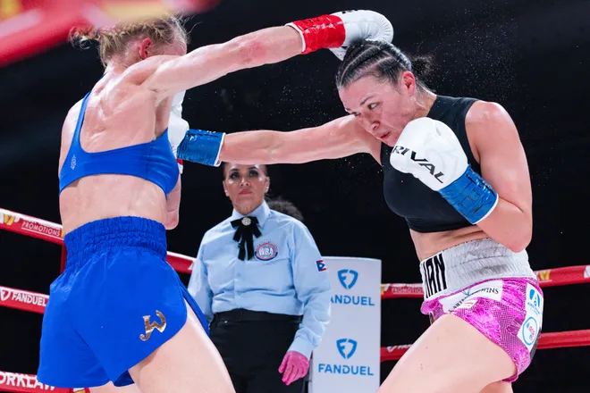 El Paso boxer Stephanie Han throws a punch at Albuquerque boxer Holly Holm during their WBA lightweight world championship bout Saturday, May 30, 2026, at the El Paso County Coliseum in El Paso, Texas.
