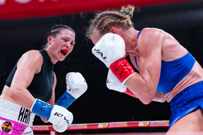 El Paso boxer Stephanie Han throws a punch at Albuquerque boxer Holly Holm during their WBA lightweight world championship bout Saturday, May 30, 2026, at the El Paso County Coliseum in El Paso, Texas.