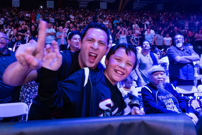 Stephanie Han's husband, Job Abner Garcia, and son, Johan, celebrate after Han defeated Albuquerque boxer Holly Holm to retain her WBA lightweight world championship Saturday, May 30, 2026, at the El Paso County Coliseum in El Paso, Texas.
