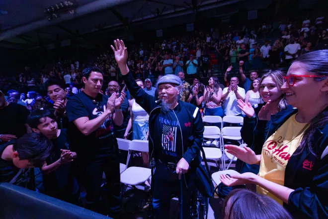 Fans clap for Stephanie Han's father after Han defeated Albuquerque boxer Holly Holm to retain her WBA lightweight world championship Saturday, May 30, 2026, at the El Paso County Coliseum in El Paso, Texas.