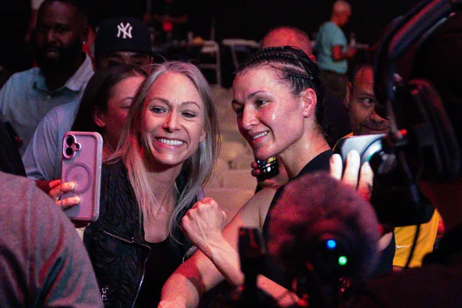 El Paso boxer Stephanie Han celebrates with fans after defeating Albuquerque boxer Holly Holm to retain her WBA lightweight world championship Saturday, May 30, 2026, at the El Paso County Coliseum in El Paso, Texas.