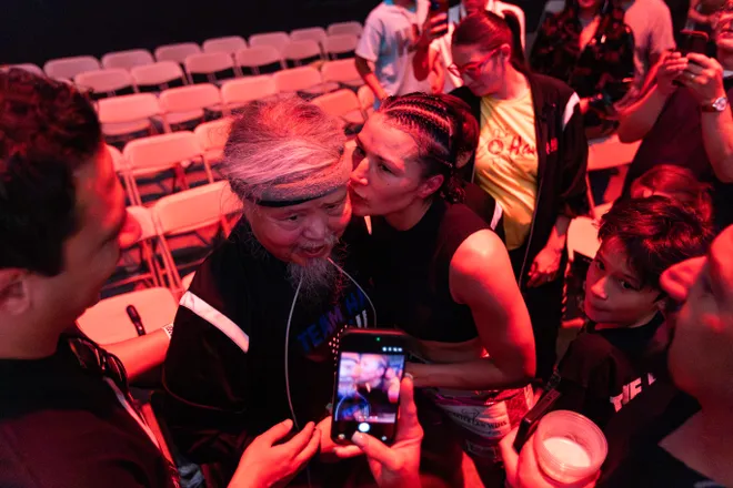 El Paso boxer Stephanie Han kisses her father after defeating Albuquerque boxer Holly Holm to retain her WBA lightweight world championship Saturday, May 30, 2026, at the El Paso County Coliseum in El Paso, Texas.