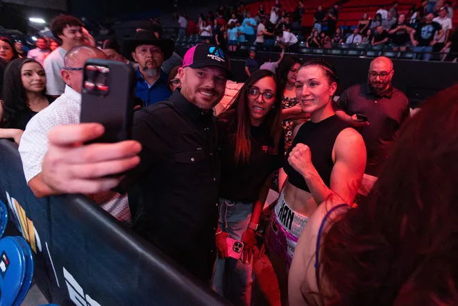 El Paso boxer Stephanie Han celebrates with fans after defeating Albuquerque boxer Holly Holm to retain her WBA lightweight world championship Saturday, May 30, 2026, at the El Paso County Coliseum in El Paso, Texas.