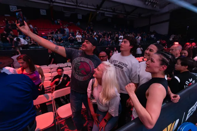 El Paso boxer Stephanie Han celebrates with fans after defeating Albuquerque boxer Holly Holm to retain her WBA lightweight world championship Saturday, May 30, 2026, at the El Paso County Coliseum in El Paso, Texas.