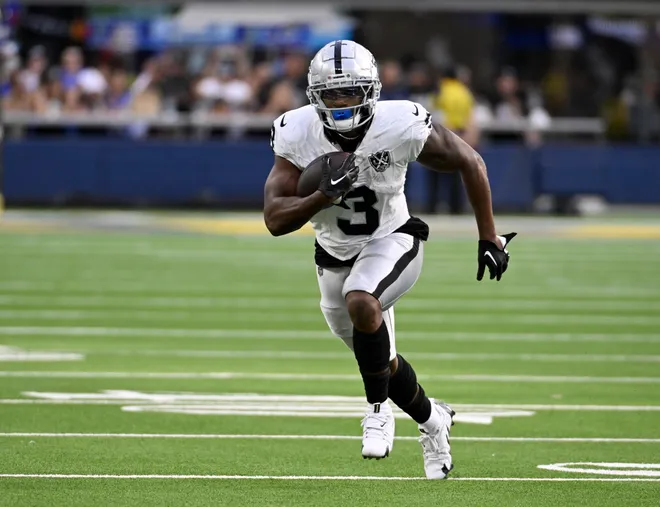 Oct 20, 2024; Inglewood, California, USA; Las Vegas Raiders running back Zamir White (3) runs after a catch against the Los Angeles Rams during the second half at SoFi Stadium. Mandatory Credit: Alex Gallardo-Imagn Images