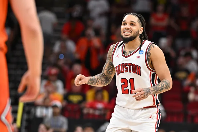 Mar 26, 2026; Houston, TX, USA; Houston Cougars guard Emanuel Sharp (21) reacts in the second half during a Sweet Sixteen game of the South Regional of the men's 2026 NCAA Tournament at Toyota Center. Mandatory Credit: Maria Lysaker-Imagn Images