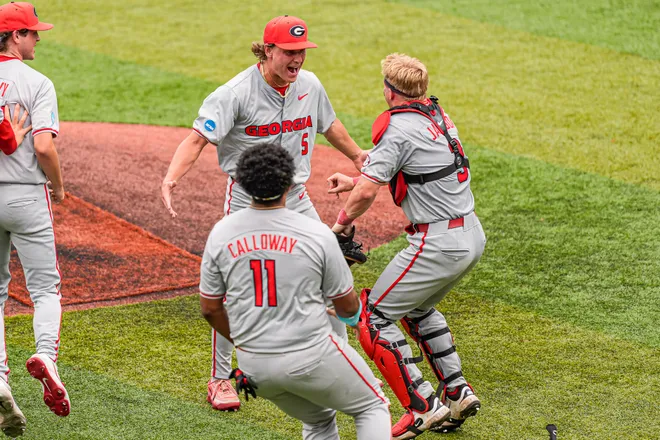 Georgia Bulldogs pitcher Justin Byrd (5) and catcher Daniel Jackson (3) react after Georgia defeated the Mississippi State Bulldogs