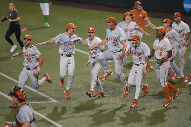Jun 7, 2026; Austin, TX, USA; Texas Longhorns run on to the field to celebrate after closing out a Super Regional game over the Oregon Ducks and securing a ticket to the College World Series at UFCU Disch-Falk field in Austin, Texas. Mandatory Credit: Scott Wachter-Imagn Images