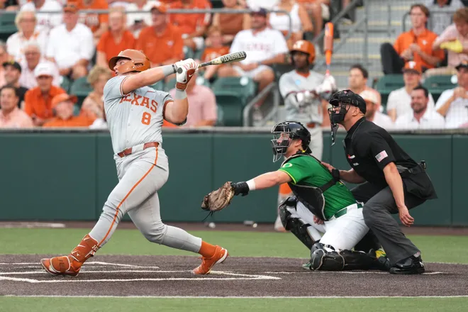 Jun 7, 2026; Austin, TX, USA; Texas Longhorns catcher Carson Tinney (8) hits a homerun during the first inning of a Super Regional game against the Oregon Ducks at UFCU Disch-Falk field in Austin, Texas. Mandatory Credit: Scott Wachter-Imagn Images