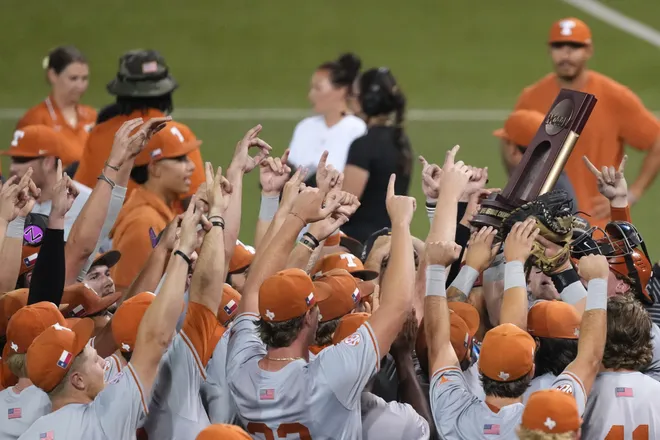 Jun 7, 2026; Austin, TX, USA; Texas Longhorns lift the trophy after closing out a Super Regional game over the Oregon Ducks at UFCU Disch-Falk field in Austin, Texas. Mandatory Credit: Scott Wachter-Imagn Images