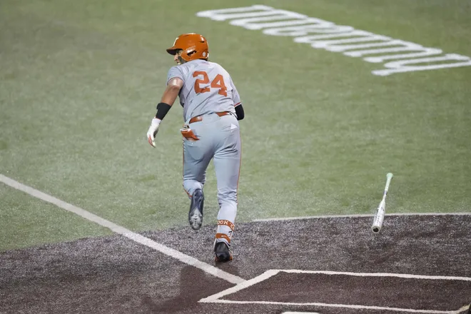 Jun 7, 2026; Austin, TX, USA; Texas Longhorns shortstop Adrian Rodriguez (24) hits a go ahead two run double in the eighth inning of a Super Regional game against the Oregon Ducks at UFCU Disch-Falk field in Austin, Texas. Mandatory Credit: Scott Wachter-Imagn Images