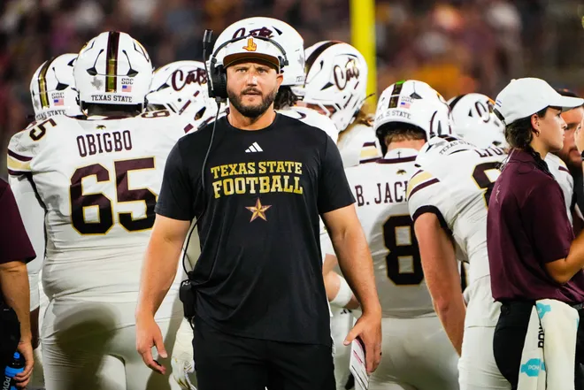 Sep 13, 2025; Tempe, Arizona, USA; Texas State Bobcats head coach G. J. Kinne during a time out in the first quarter of the game between Arizona State Sun Devils and Texas State Bobcats. Mandatory Credit: Arianna Grainey-Imagn Images