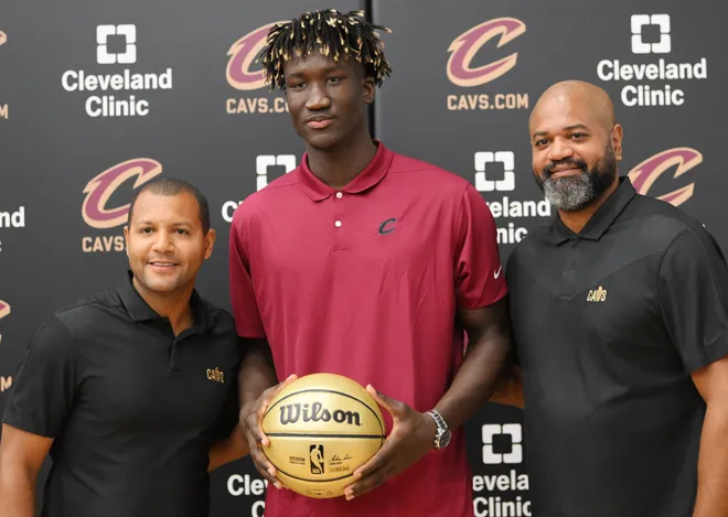 Jun 24, 2022; Independence, Ohio, USA; Cleveland Cavaliers president of basketball operations Koby Altman, left, and Cleveland Cavaliers head coach J.B. Bickerstaff, right, pose with second round draft pick Khalifa Diop during a press conference introducing the first two draft picks of the Cavaliers at Cleveland Clinic Courts. Mandatory Credit: Ken Blaze-USA TODAY Sports