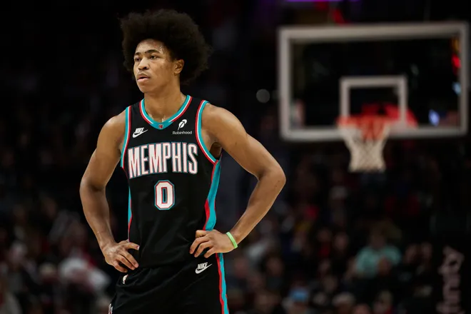 Feb 6, 2026; Portland, Oregon, USA; Memphis Grizzlies forward Jaylen Wells (0) stands during the first half against Portland Trail Blazers forward Toumani Camara (33) at Moda Center. Mandatory Credit: Troy Wayrynen-Imagn Images