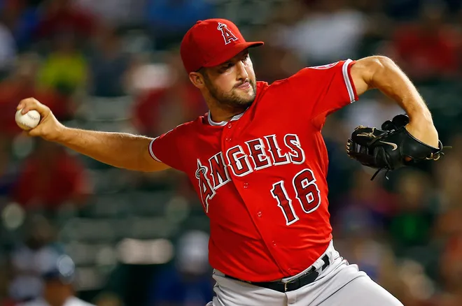 ARLINGTON, TX - AUGUST 15: Huston Street #16 of the Los Angeles Angels pitches against the Texas Rangers in the bottom of the ninth inning at Globe Life Park in Arlington on August 15, 2014 in Arlington, Texas. (Photo by Tom Pennington/Getty Images)