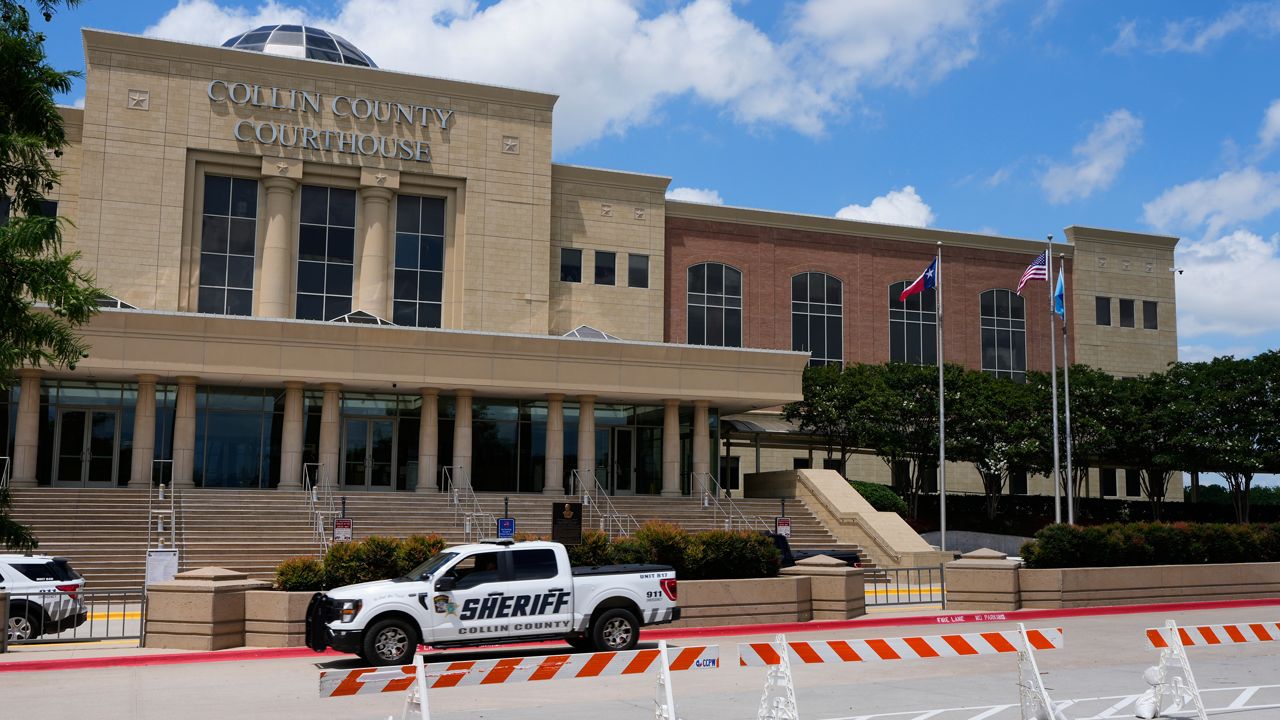 A Collin County seriff drives past the front of the county courthouse Thursday, June 4, 2026, in McKinney, Texas. (AP Photo/Tony Gutierrez)
