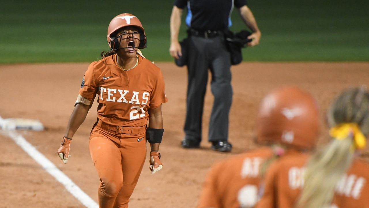 Texas' Kayden Henry celebrates after hitting a home run during the second game of the NCAA Women's College World Series softball finals against Texas Tech in Oklahoma City, Thursday, June 4, 2026. (AP Photo/Kyle Phillips)