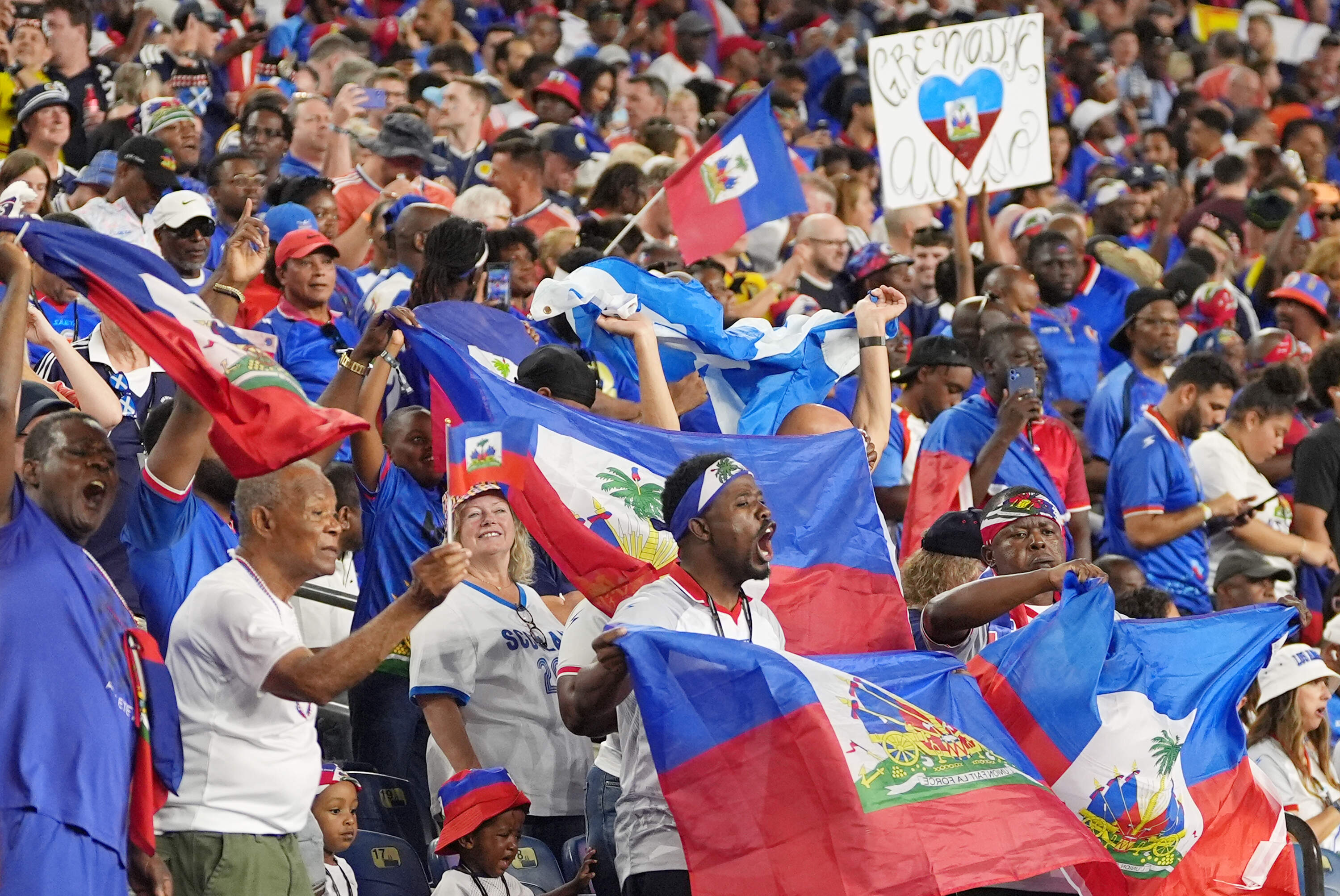 Haiti fans cheer during the World Cup Group C soccer match between Haiti and Scotland in Foxborough. (Charlie Krupa/AP)
