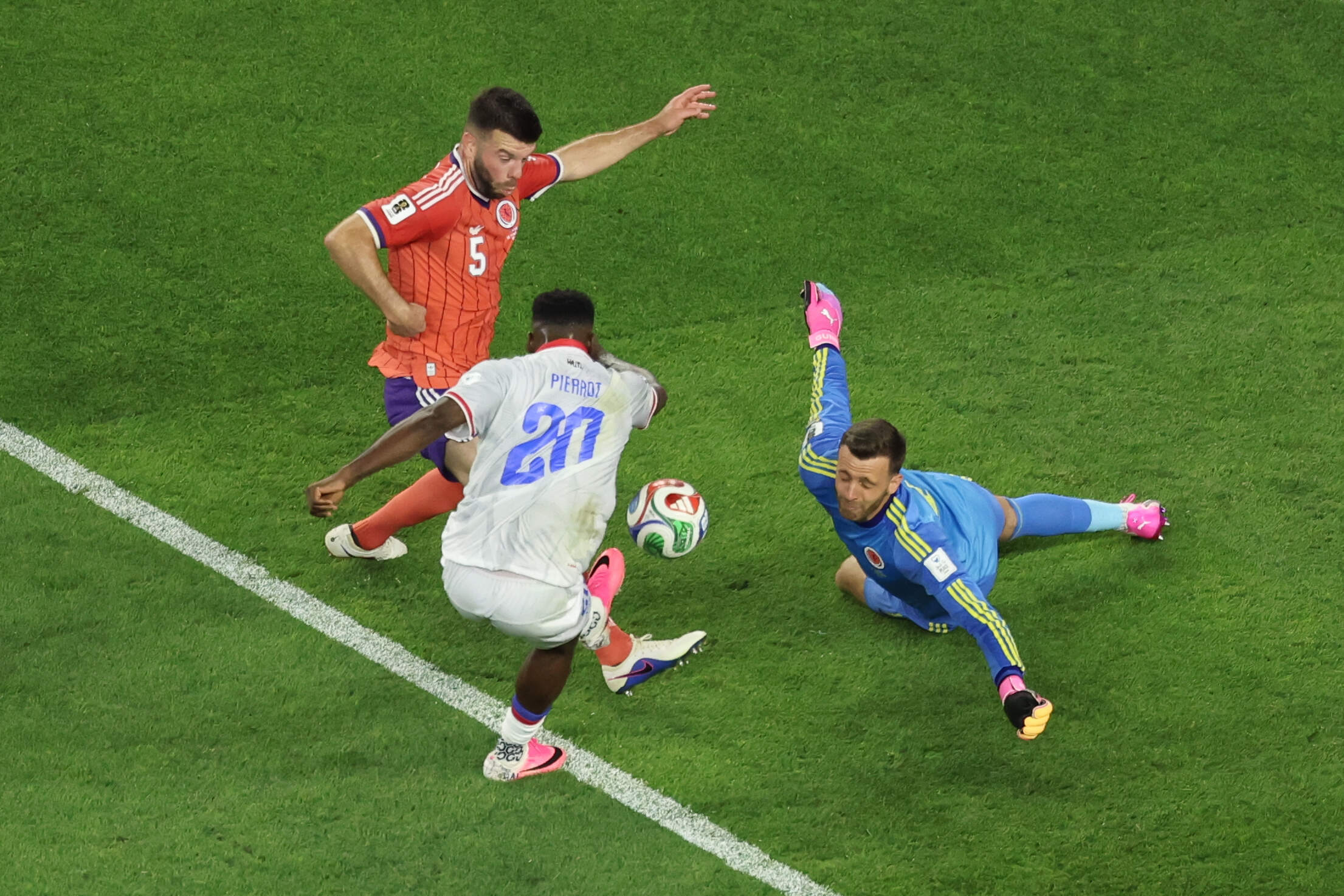 Haiti's Frantzdy Pierrot (20) makes an attempt to score against Scotland goalkeeper Angus Gunn (1) during the World Cup Group C soccer match between Haiti and Scotland in Foxborough. (Mark Stockwell/AP)