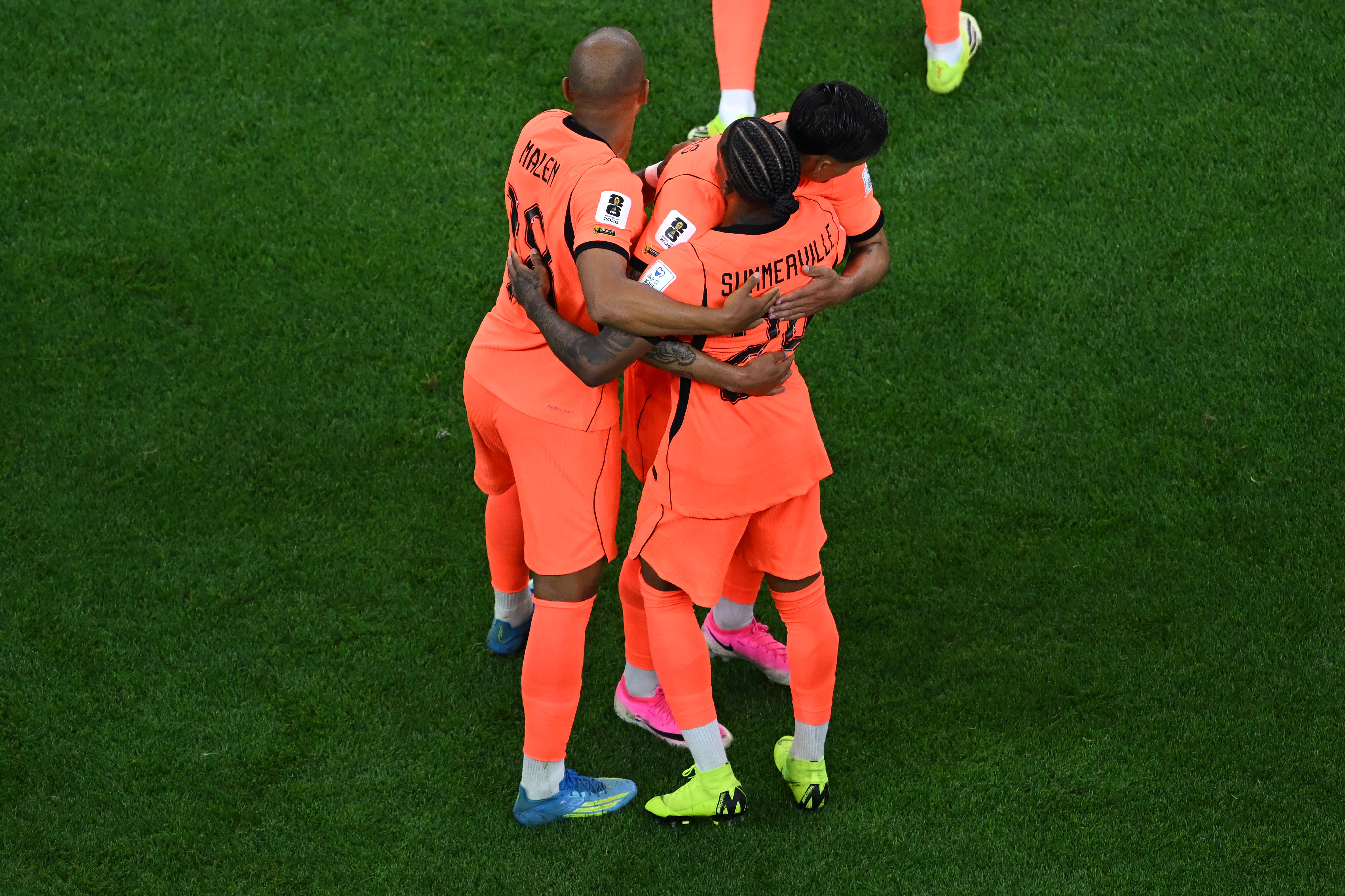 Netherlands’ Crysencio Summerville (24) is congratulated by teammates after scoring...