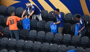 Japan fans clean up trash in the stadium following the World Cup Group F soccer match between the Netherlands and Japan in Arlington, Texas, near Dallas, Sunday, June 14, 2026. (AP Photo/Jessica Tobias)