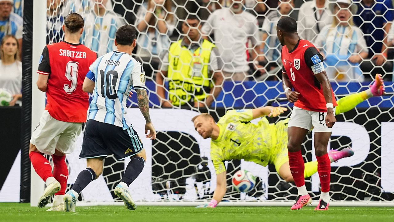 Argentina's Lionel Messi, center, scores the opening goal during the World Cup Group J soccer match between Argentina and Austria in Arlington, Texas, near Dallas, Monday, June 22, 2026. (AP Photo/Julio Cortez)