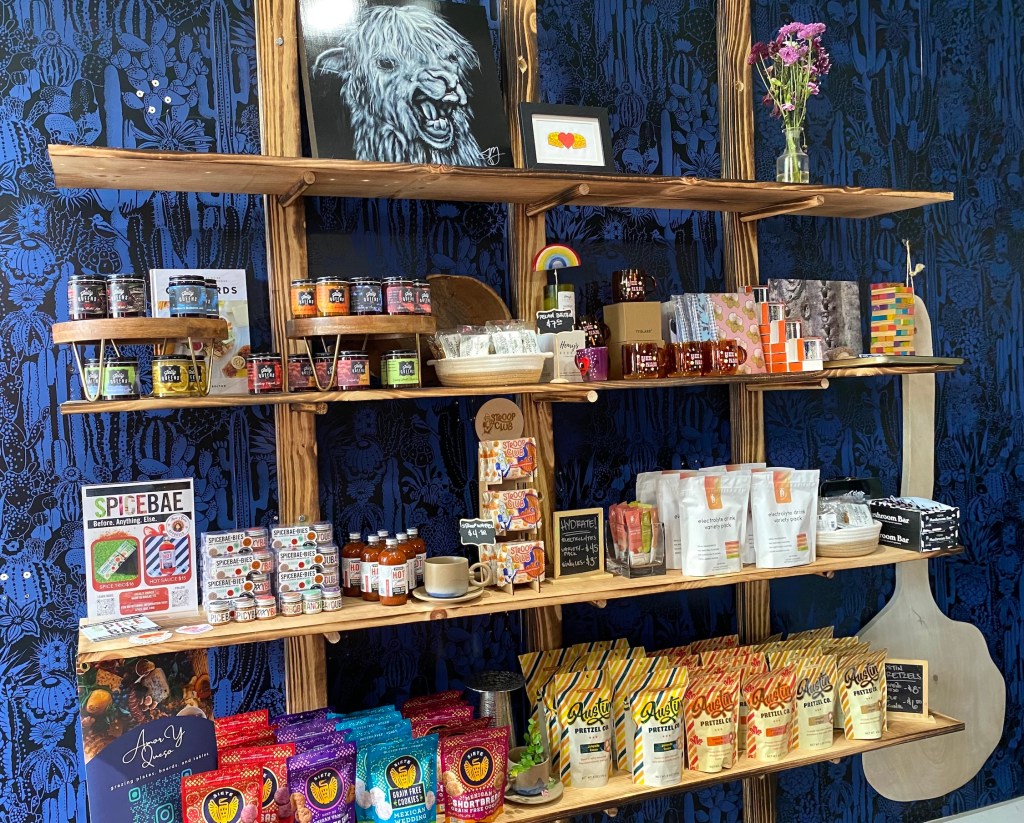 a shelf loaded with items inside Amor y Queso.