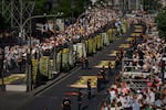 People wait for the arrival of Pope Leo XIV ahead of a Holy Mass and Corpus Christi procession at Plaza de Cibeles in Madrid, Spain, Sunday, June 7, 2026, on the second day of his seven-day apostolic visit to mainland Spain and the Canary Islands.