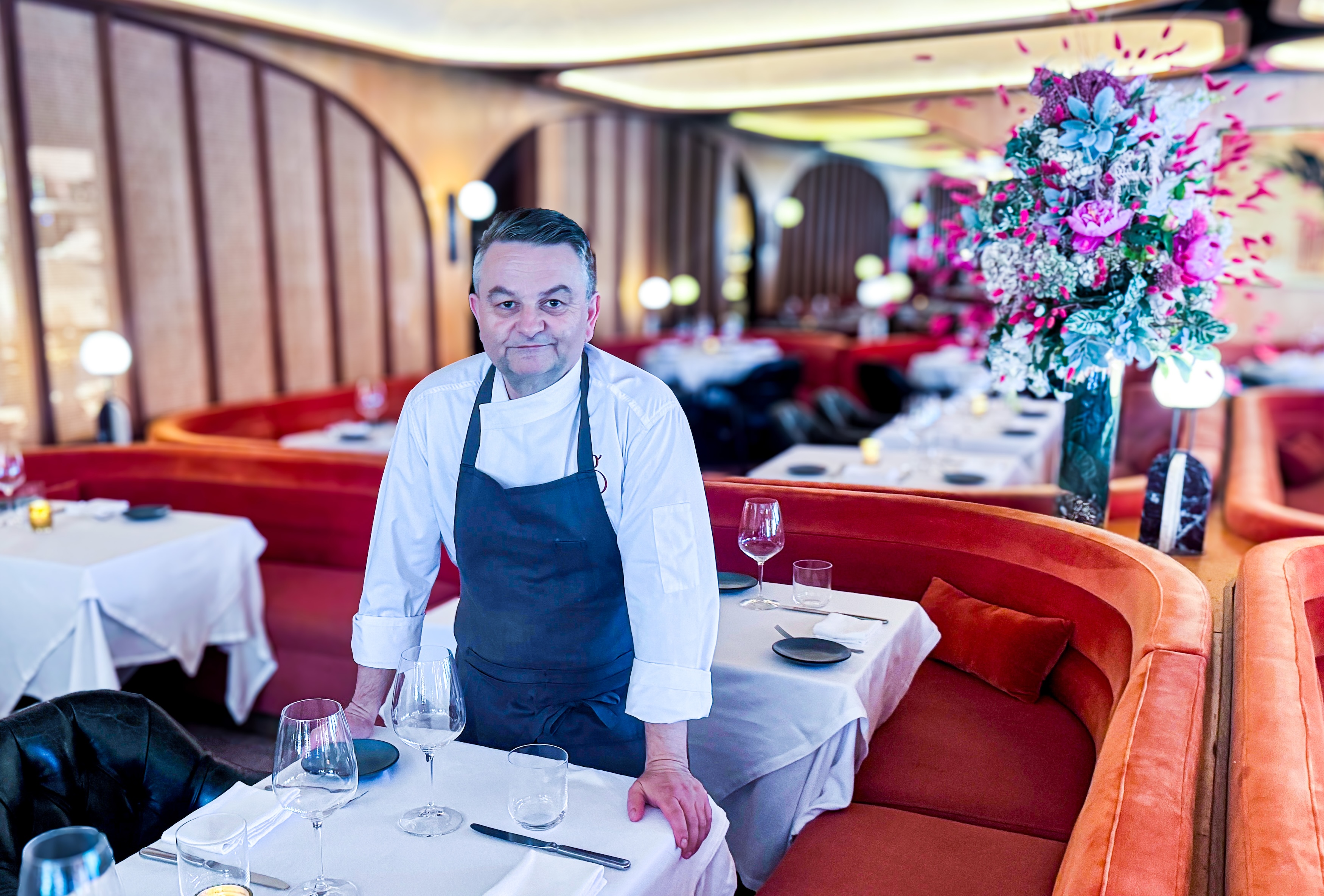 chef bruno davaillon standing in the dining room at Georgie
