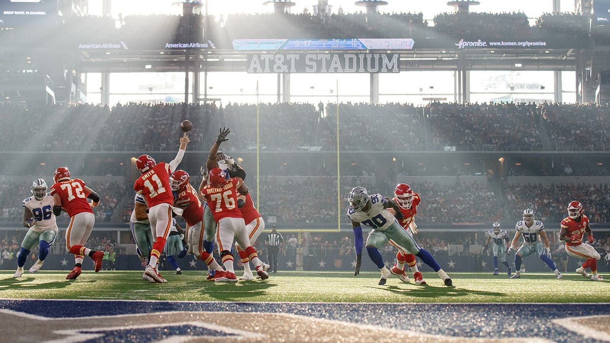Alex Smith throws a pass at AT&T Stadium in Arlington, Texas.