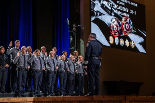 Sheriff swearing in deputies.