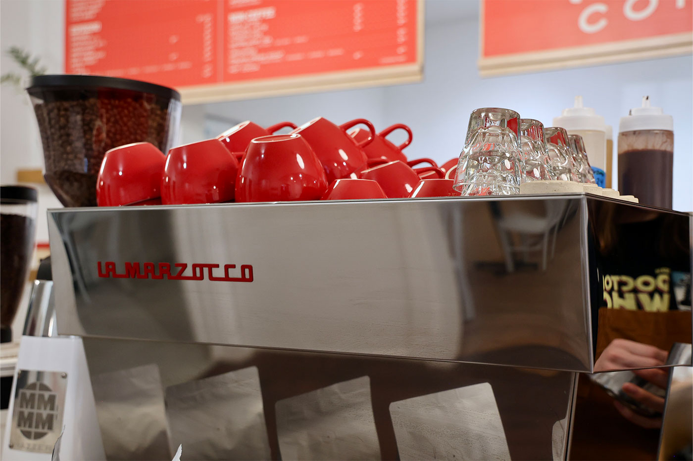 espresso machine with red cups