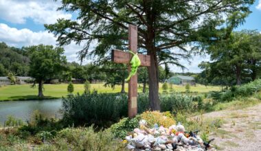 A makeshift memorial dedicated to the lives of the 25 girls and two teenage counselors who were killed during last year's Texas Hill Country flash floods is seen on June 24, 2026 in Hunt, Texas. Camp Mystic has filed for Chapter 11 bankruptcy nearly one year after the devastating July 4th Texas Hill Country floods that claimed the lives of 25 girls and two teenage counselors at the camp’s location along the Guadalupe River.