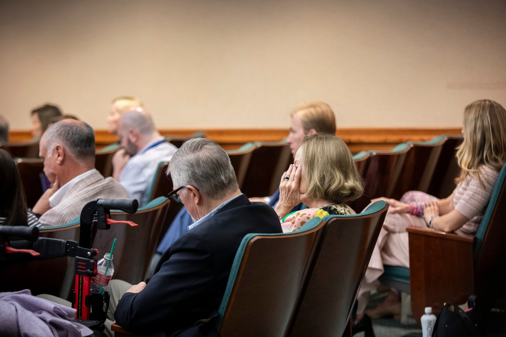 A member from the public wipes tears away as Vice Chair Joe Moody gives final remarks at the House General Investigating Committee on the July 2025 Flooding Events meeting in Austin on Thursday, June 16, 2026.