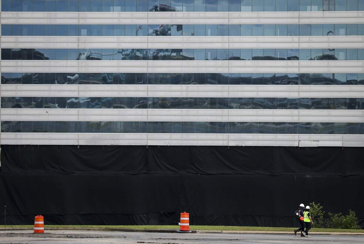 Workers prepare to implode the old Sheraton Hotel on Saturday, June 6, 2026 in Arlington, Texas. The implosion marks the beginning of construction on the 507-room Americana by Loews Hotel north of Choctaw Stadium at 1500 Convention Center Drive.