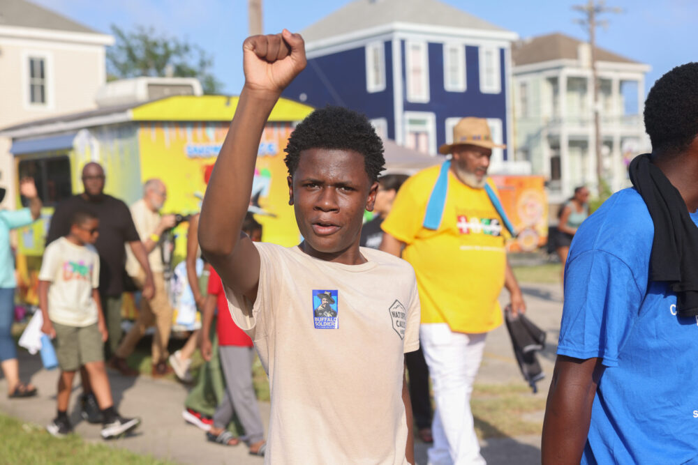 A child at a parade in Galveston for Juneteenth