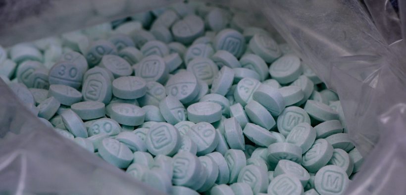 A large bag of seized counterfeit 30 mg Oxy laced with fentanyl is displayed at the Drug Enforcement Administration lab.